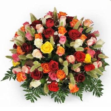 L'Agitateur Floral | image de la composition piquée de roses jaunes rouges et oranges